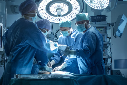 Person doing surgery Person doing surgery