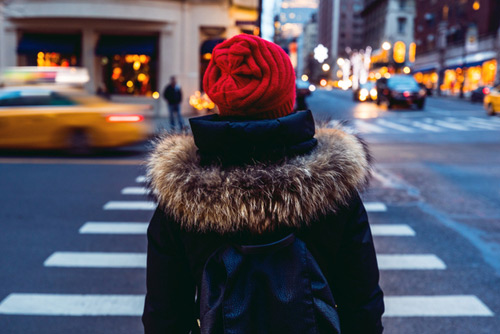 Woman walking across road in crosswalk